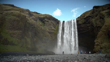 People-at-the-Base-of-Large-Waterfall