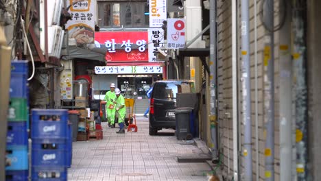 Street-Cleaners-Working-in-Back-Street