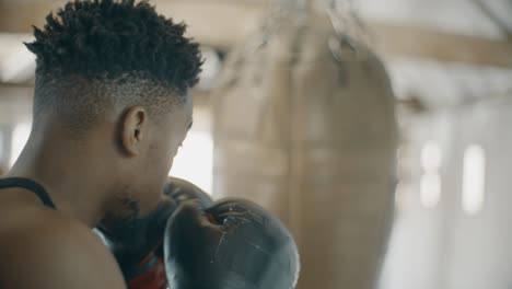 Slow-Motion-Boxer-Punching-Boxing-Bag
