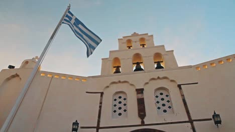 Time-Lapse-of-Bell-Tower-and-Greek-Flag