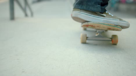 Skateboarder-Rolling-Down-Ramp-at-Skatepark
