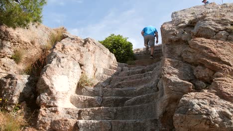 Tourist-Climbing-Steps-in-Athens