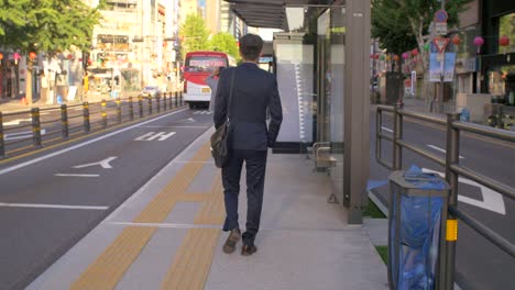 Businessman-Walking-to-Bus-Stop