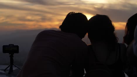 Young-Couple-Watching-Sunset