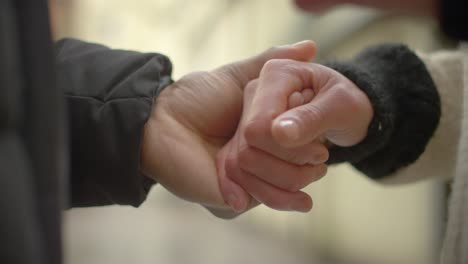 Couple-Holding-Hands-Close-Up