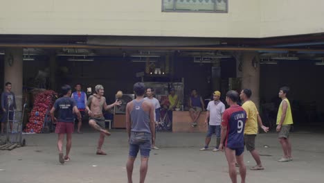 Men-Playing-Ball-Game-in-Bangkok