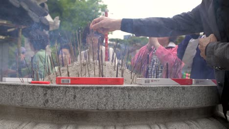 Offering-Incense-in-Buddhist-Temple