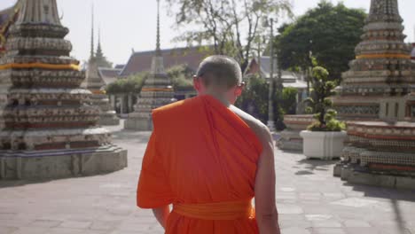 Buddhist-Monk-Walking-Through-Temple