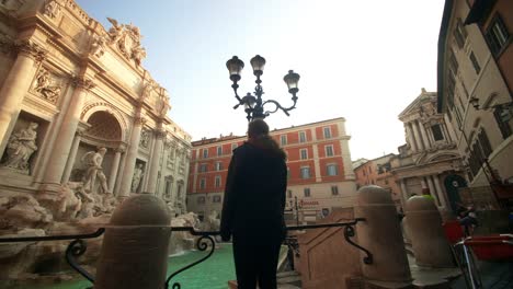 Woman-Looking-At-Trevi-Fountain