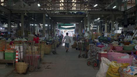 Man-Walking-Through-Bangkok-Market