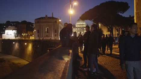 Young-People-on-Bridge-Wall-at-Night