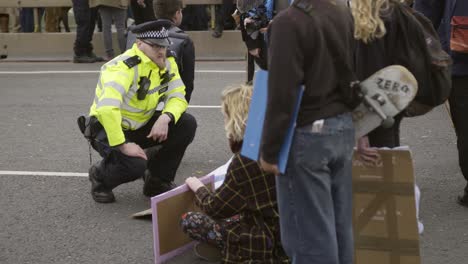 Policeman-Talking-To-Protesters