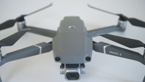 Drone-on-White-Surface-Tilt-Shot
