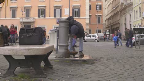 Man-Drinking-From-Water-Fountain