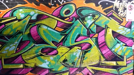 Graffiti-en-la-pared-de-ladrillo-toma-de-mano