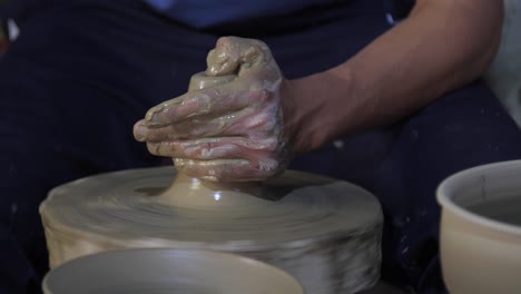 Potter-Throwing-Clay
