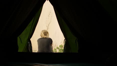 Woman-Sat-Outside-Tent
