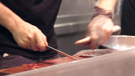 Fishmonger-Chopping-Fresh-Eels