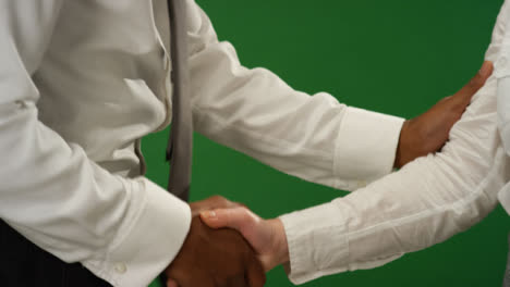 CU-Two-people-shaking-hands-on-green-screen