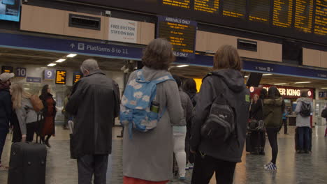 Two-women-watching-the-train-departure-board