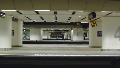 Commuters-waiting-on-train-platforms