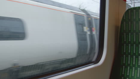 Looking-out-from-moving-train-passing-another-train
