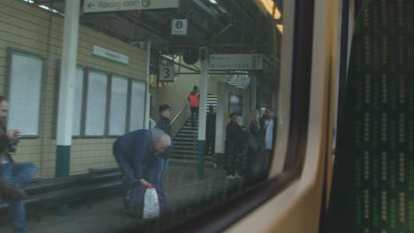 Train-stopping-at-station-awaiting-passengers