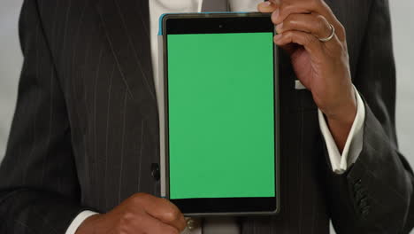 CU-Man-Holding-Tablet-at-Camera-with-Green-Screen