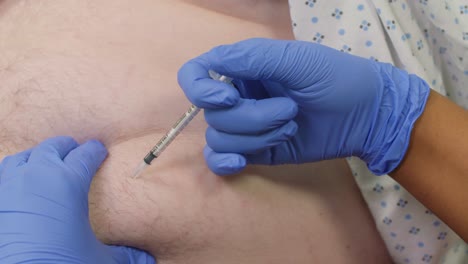 Nurse-Injects-Syringe-into-Patient