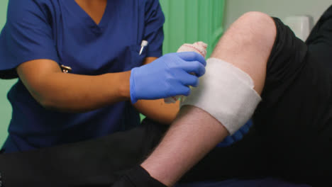 CU-Nurse-Bandaging-Injured-Leg