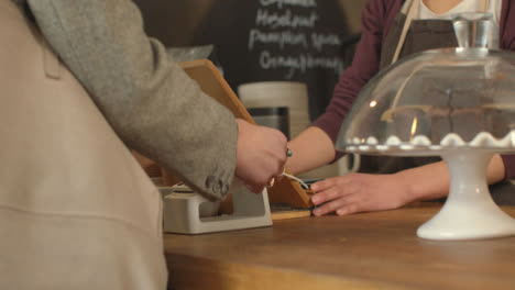 Woman-Paying-for-Coffee-Using-Contactless