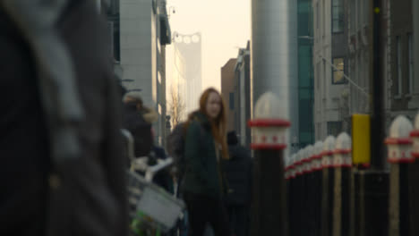 Blurred-Pedestrians-Walk-On-Busy-London-Street-Near-Tube-Station,-Daytime