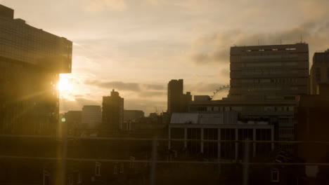 London-Skyline-at-Sundown-From-Moving-Train