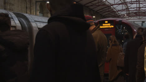 Commuters-Waiting-on-Platform-at-London-Underground-Station