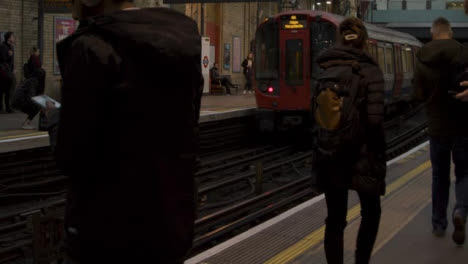 Commuters-Waiting-For-Train-On-London-Train-Station-Platform-