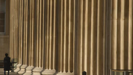 Person-Walking-Through-Columns-at-British-Museum