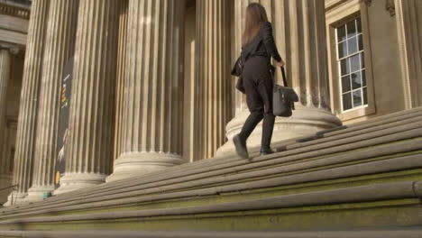 Low-Angle-View-Woman-Walking-Up-Steps-at-British-Museum-London