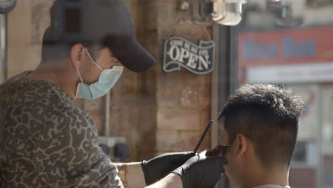 Pull-Focus-Barber-Wearing-Face-Mask-to-Open-Sign