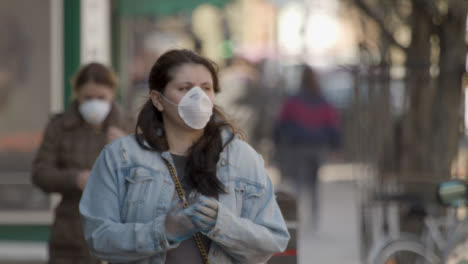 Women-walking-on-street-while-wearing-face-masks