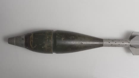 Mortar-Shell-on-White-Surface