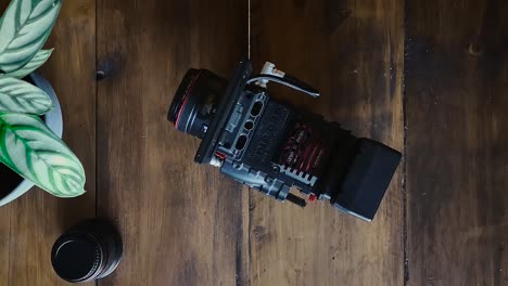 Flat-Lay-Filmmaker-Grabs-Camera