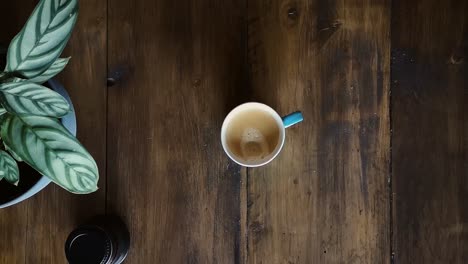 Flat-Lay-Grabbing-Coffee-Cup