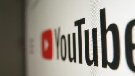 Close-Up-Pan-of-Youtube-GB-Logo-on-Monitor