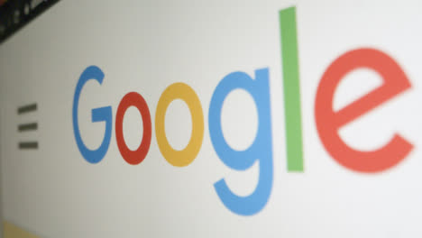 Close-Up-Pan-of-Google-Logo-on-Screen
