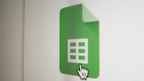 Close-Up-Pan-Clicking-on-Google-Sheets-Icon-on-Screen
