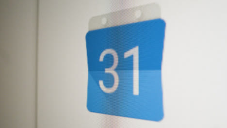 Close-Up-Pan-Clicking-on-Google-Calendar-Icon-on-Screen