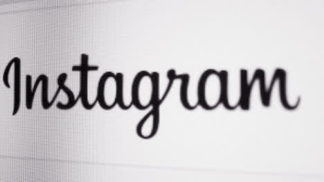 Close-Up-Reveal-of-Instagram-logo-on-screen