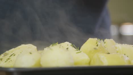 Close-Up-Sprinkling-Salt-on-Hot-Potatoes