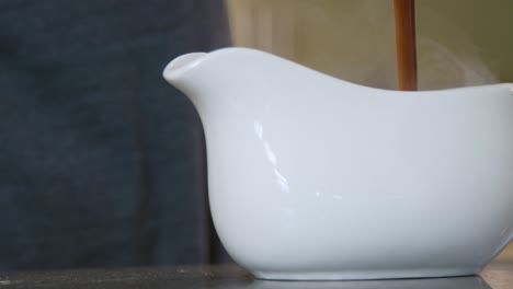 Close-Up-Pouring-Gravy-into-Gravy-Boat
