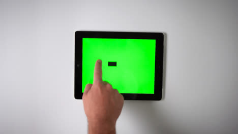 Flat-Lay-Tablet-Green-Screen-Finger-Pulling-Down